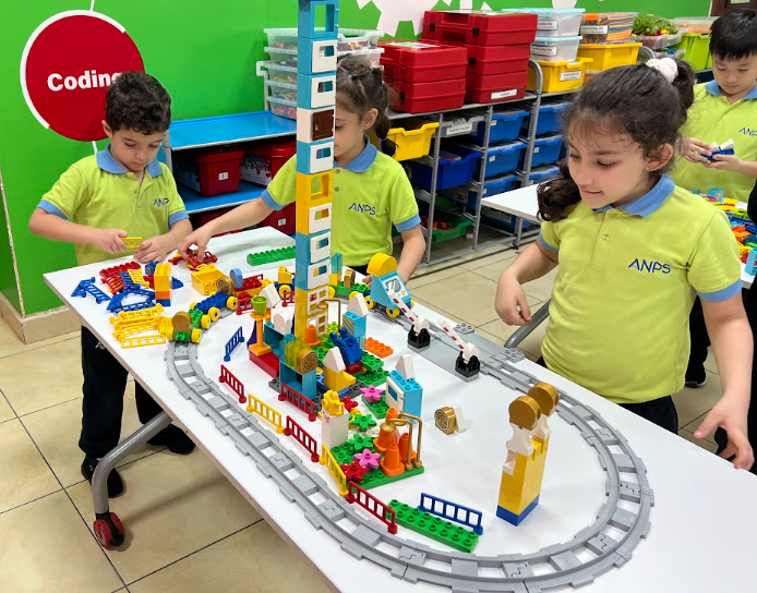 Children building with construction blocks