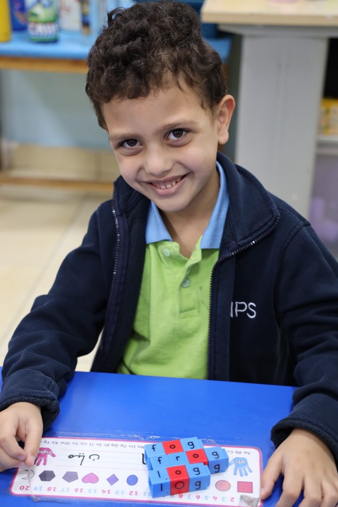 Kindergarten child taking part with confidence